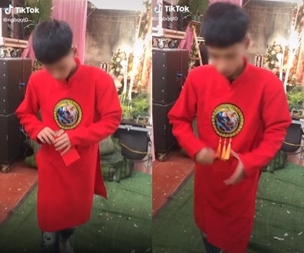 Nhận được số tiền 30.000 đồng trong phong bao, chàng trai lập tức vứt đi... (Ảnh cắt từ clip)